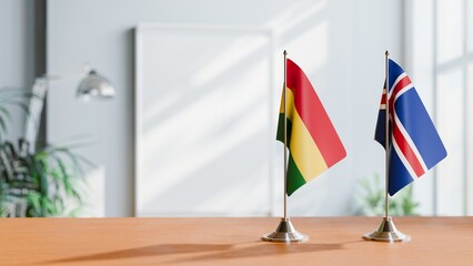 FLAGS OF BOLIVIA AND ICELAND ON TABLE