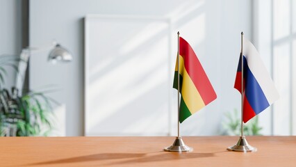 FLAGS OF BOLIVIA AND RUSSIA ON TABLE