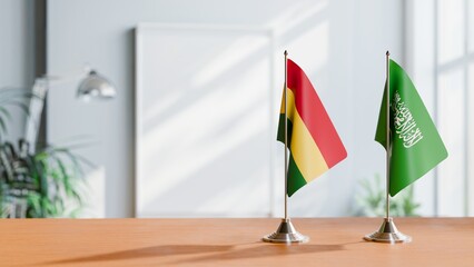 FLAGS OF BOLIVIA AND SAUDI ARABIA ON TABLE