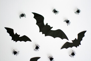 macro shooting of Halloween decorations in the form of spiders and bats on a white background
