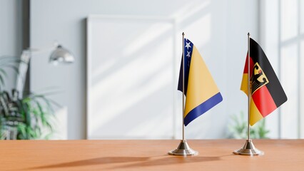 FLAGS OF BOSNIA AND GERMANY ON TABLE