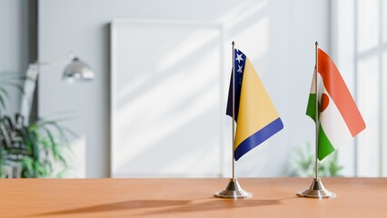 FLAGS OF BOSNIA AND NIGER ON TABLE