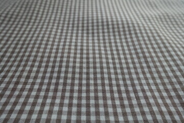 Closeup of cotton fabric with grey and white gingham pattern