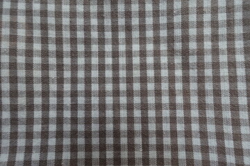 Macro of cotton fabric with grey and white gingham pattern