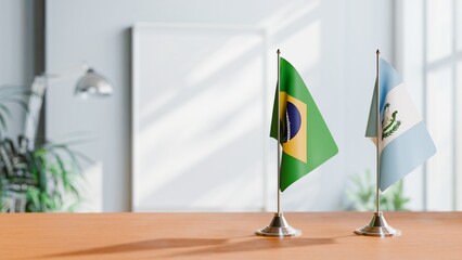 FLAGS OF BRAZIL AND GUATEMALA ON TABLE