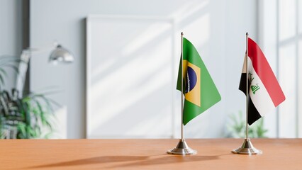 FLAGS OF BRAZIL AND IRAQ ON TABLE