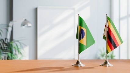 FLAGS OF BRAZIL AND ZIMBABWE ON TABLE