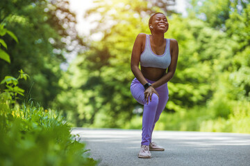 Nature, fitness and woman stretching legs muscle for morning exercise, cardio or training on green field. Wellness, body care warm up and park athlete, runner and start outdoor workout.