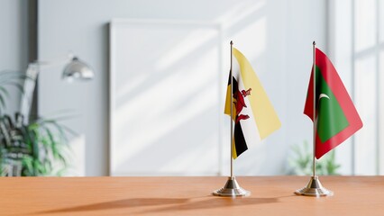 FLAGS OF BRUNEI AND MALDIVES ON TABLE