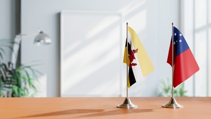 FLAGS OF BRUNEI AND SAMOA ON TABLE