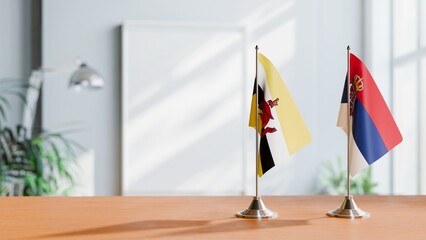 FLAGS OF BRUNEI AND SERBIA ON TABLE