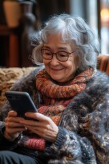 Woman using cell phone on couch