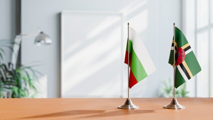 FLAGS OF BULGARIA AND DOMINICA ON TABLE