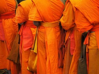 bright organge dresses from the monks in laos