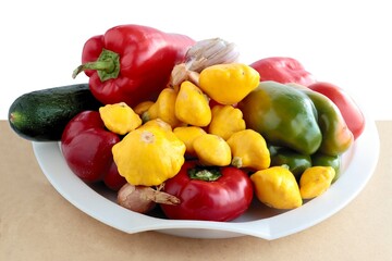colorful various peppers and yellow small patissons as tasty vegetables