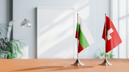 FLAGS OF BULGARIA AND SWITZERLAND ON TABLE