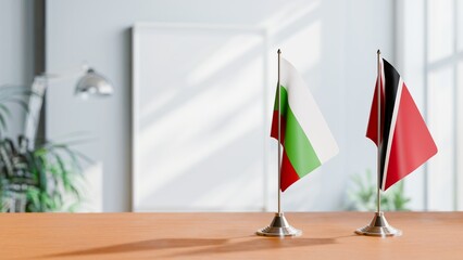 FLAGS OF BULGARIA AND TRINIDAD ON TABLE