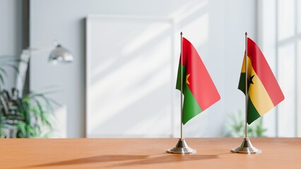 FLAGS OF BURKINA-FASO AND GHANA ON TABLE