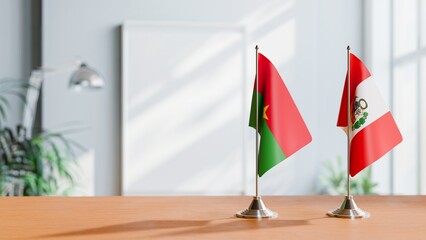 FLAGS OF BURKINA-FASO AND PERU ON TABLE