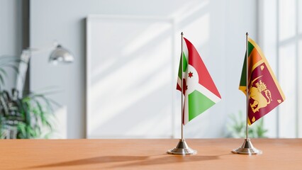 FLAGS OF BURUNDI AND SRI LANKA ON TABLE