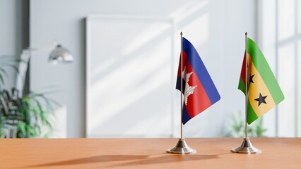 FLAGS OF CAMBODIA AND SAO TOME ON TABLE