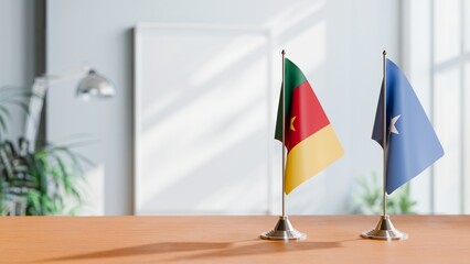 FLAGS OF CAMEROON AND SOMALIA ON TABLE