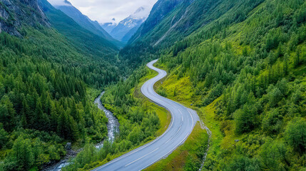 A peaceful rural landscape featuring lush green fields and gentle rolling hills under a clear blue sky.