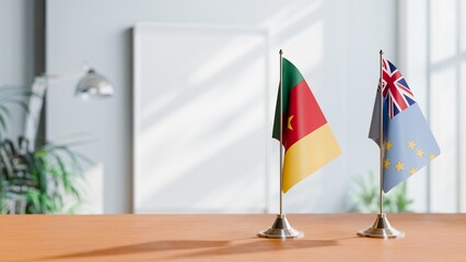 FLAGS OF CAMEROON AND TUVALU ON TABLE