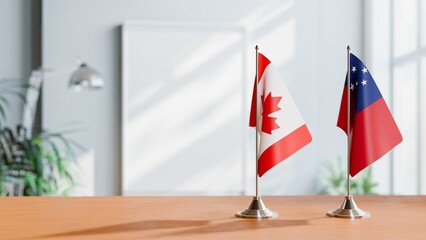 FLAGS OF CANADA AND SAMOA ON TABLE