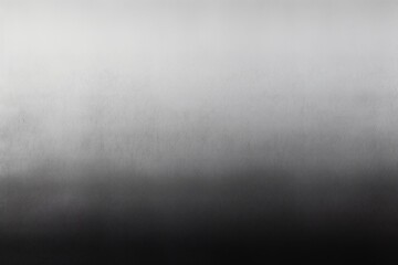 A flat, grainy gradient with a texture ranging from light grey to black.