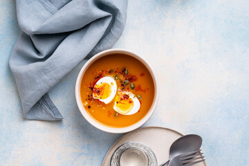 Pumpkin soup with boiled egg, autumn or winter delicious healthy food