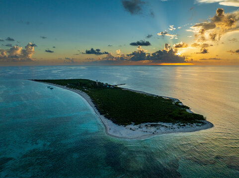Aerial view of beautiful Alacranes Reef with turquoise waters and a stunning sunset, Progreso, Mexico.