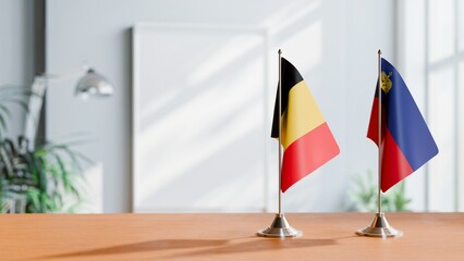 FLAGS OF CHAD AND LIECHTENSTEIN ON TABLE