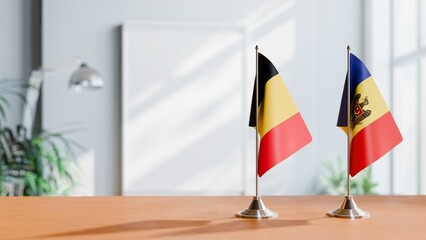 FLAGS OF CHAD AND MOLDOVA ON TABLE