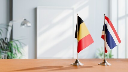 FLAGS OF CHAD AND THAILAND ON TABLE