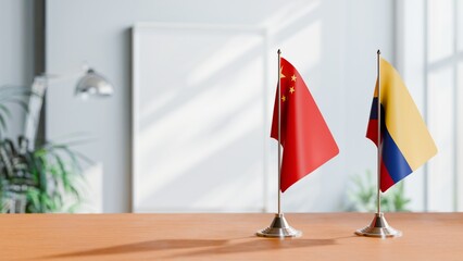 FLAGS OF CHINA AND COLOMBIA ON TABLE