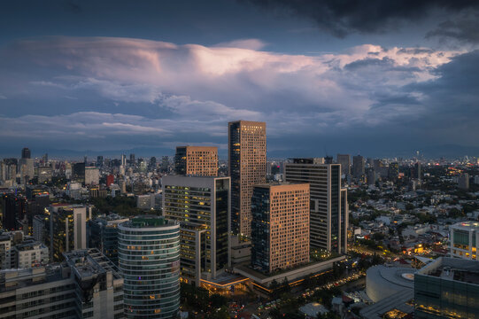 Aerial view of miyana tower and cityscape at sunset with beautiful clouds, Miguel Hidalgo, Mexico.