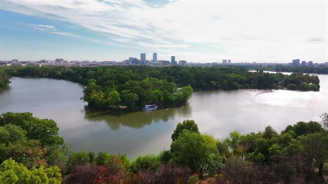 Northern part of Bucharest from above. Aerial cityscape 4k video with Bucharest, Romania, next to Arch of Triumph, Herastrau Lake and Free Press Square (Piata Presei Libere in Romanian). Visit Romania