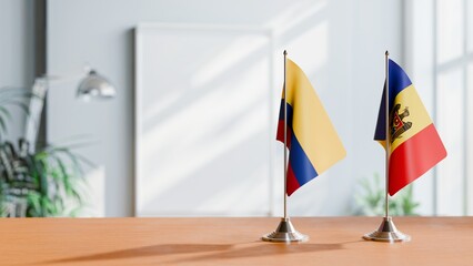 FLAGS OF COLOMBIA AND MOLDOVA ON TABLE