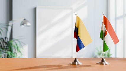 FLAGS OF COLOMBIA AND NIGER ON TABLE