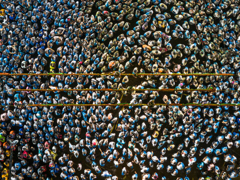 Aerial view of vibrant Dahi Handi festival with a bustling crowd celebrating together, Thane, India.
