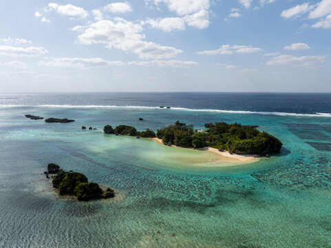 Aerial view of the beautiful Yojima island with turquoise ocean and serene beach, Onna Son, Kunigami District, Japan.