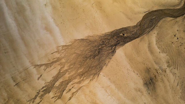 Aerial view of abstract sand patterns and textures at Eoropie Beach, Ness, Isle of Lewis, Scotland.