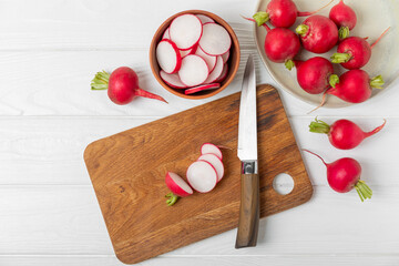 Fresh radish on textured wooden background. Organic natural garden radish slices. clipping root crop. Vegetables. Vegan. Diet products. Healthy food. Place for text. Copy space.