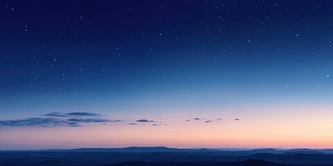 Fototapeta premium A serene twilight sky filled with stars and a distant horizon.