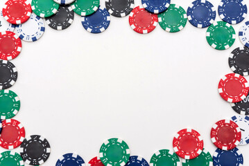 Colorful poker chips arranged in a frame on a white background