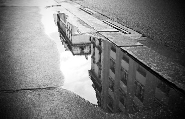 Reflections in a puddle, street photography in Paris