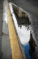Reflections in a puddle, street photography in Paris