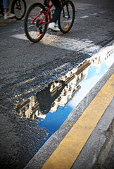 Reflections in a puddle, street photography in Paris