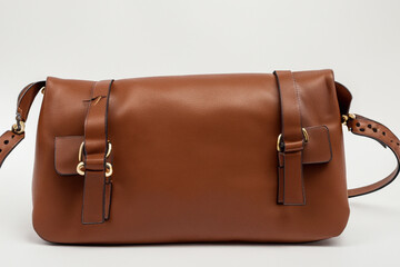 Brown and white white. paper wrapped bag with food. fashion design handbag concept. brown and white bag with a white. a paper wrapped bag with food. a concept of a leather bag with food packaged in.